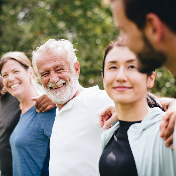 group of people with their arms around each other